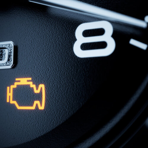 close-up of a check engine light on a car dashboard