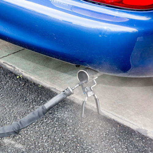 A Car Receives an Emissions Test of Exhaust.