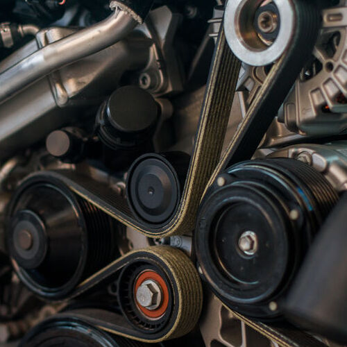 Serpentine belt inside an engine.