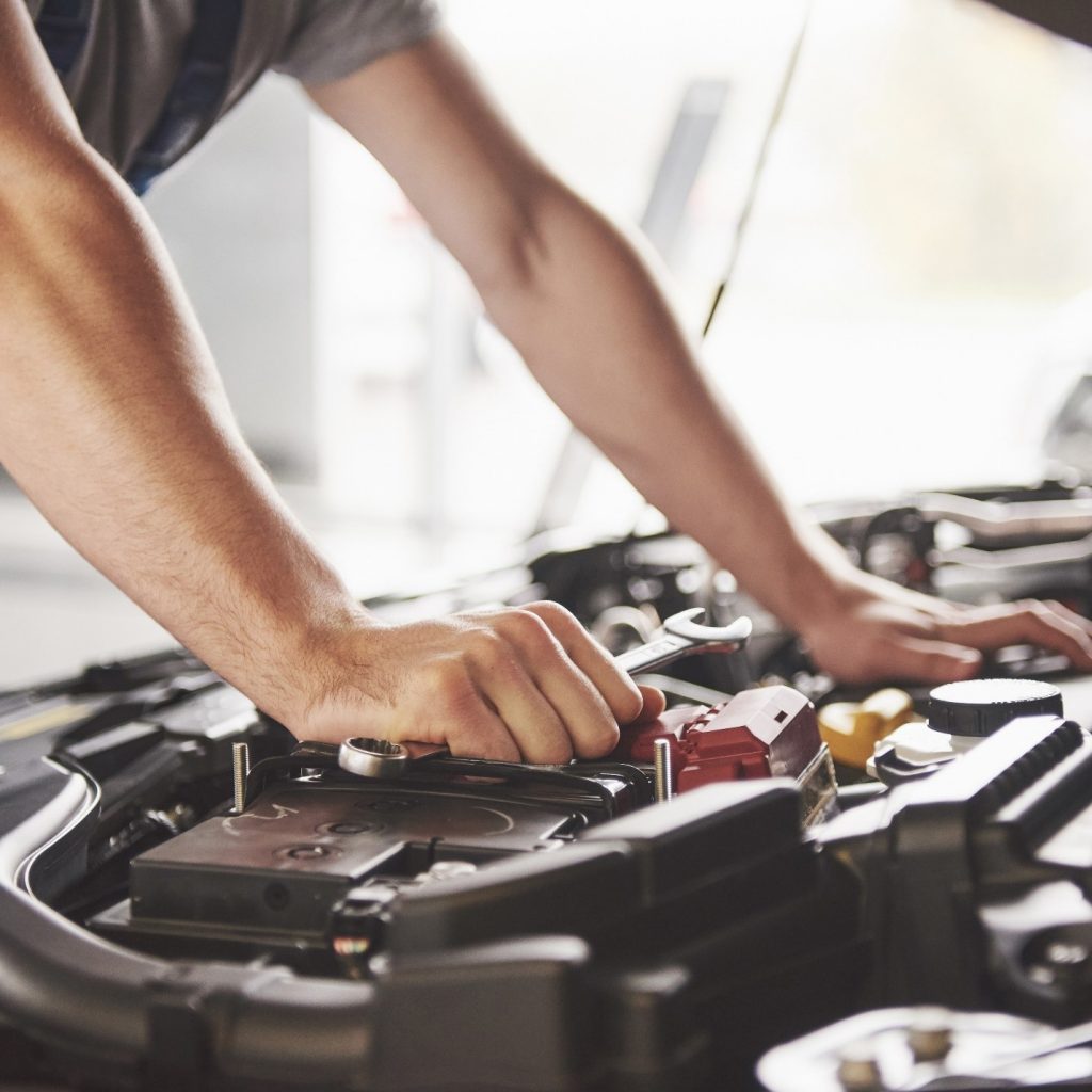 man working on engine